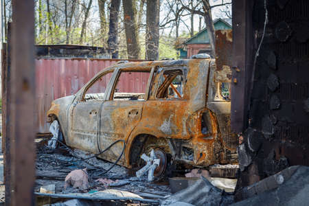 Cars in Irpin. May, 2022. Irpin, Kyiv region, Ukraine. Russia Ukraine war. Damaged in Irpin after fightingのeditorial素材