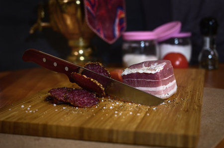 The knife cutting sausage and meatの写真素材