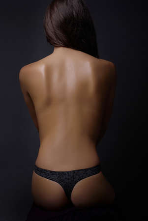 Young brunette beauty nude women backの写真素材