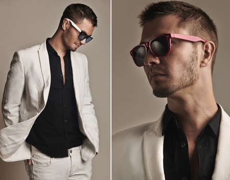 Fashion young with fashionable sunglasses on gray backgroundの写真素材