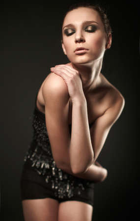 portrait of fashion woman model with beauty bright make-up and pin dressの写真素材