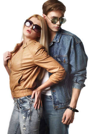 Sexy young couple wearing jeans in the studioの写真素材