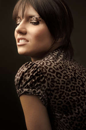 portrait of fashion male model with beauty leopard make-upの写真素材