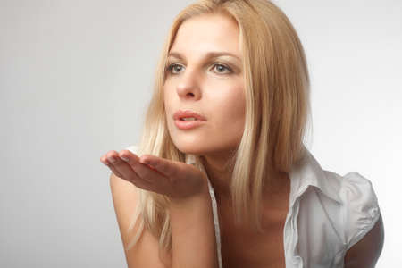 Beautiful woman sending a kissの写真素材