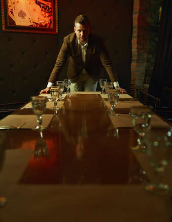 Thoughtful handsome businessman  in restaurantの写真素材