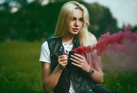 fashion outdoor portrait of girl with cup.の写真素材