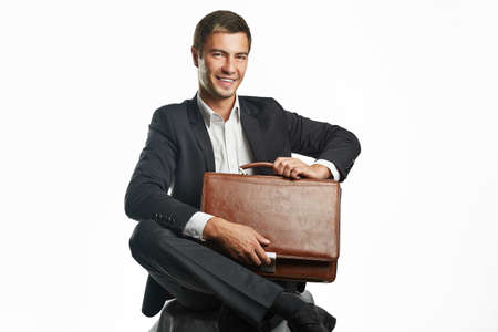 young business man holding a suitcase
