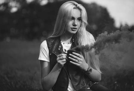 fashion outdoor portrait of girl with cup.の写真素材