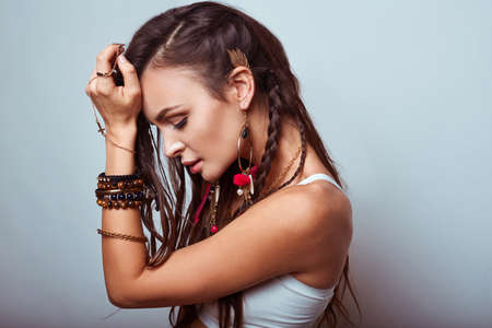 Portrait of beautiful young hippie woman in studioの写真素材