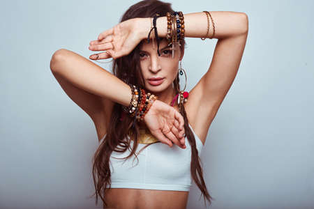 Portrait of beautiful young hippie woman in studioの写真素材