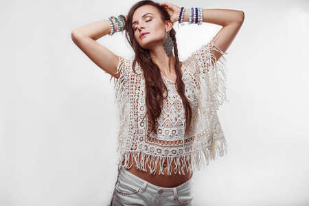 Portrait of beautiful young hippie woman in studioの写真素材