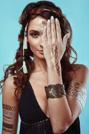 Portrait of beautiful glamor hipster young hippie woman in knitted braの写真素材