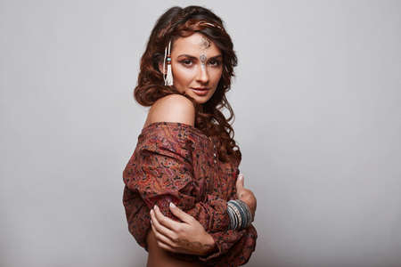 Portrait of beautiful glamor hipster young hippie woman in studioの写真素材