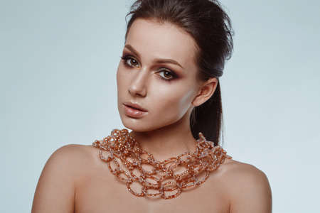 Portrait of beautiful, glamorous, sensual brunette model in studioの写真素材