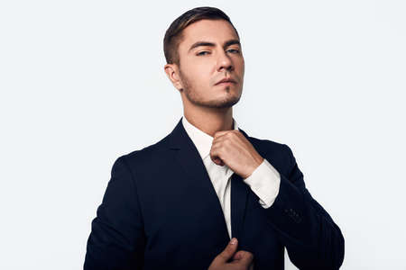 young handsome business man in suit isolated on white background in studioの写真素材