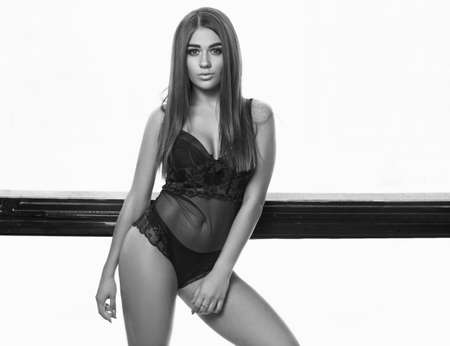 Portrait of gorgeous beauty young woman in sexy body on bright backgroundの写真素材