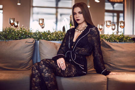 Portrait of gorgeous beauty young woman in luxury interiorの写真素材