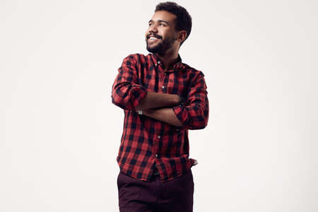 Isolated portrait of fashionable brutal young African American male hipster in red casual shirt
