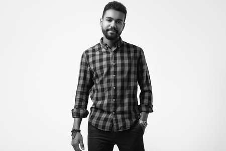 Isolated portrait of fashionable brutal young African American male hipster in red casual shirtの写真素材