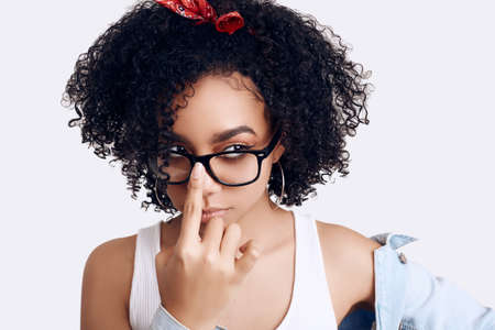 Sensual portrait of glamor elegant black hippie teenage girl model with curly hair isolated on white studio backgroundの写真素材