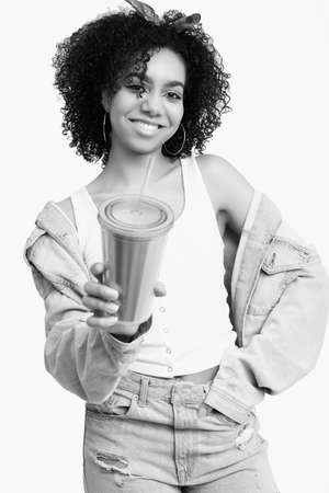 Sensual portrait of glamor elegant black hippie teenage girl model with curly hair drink soda isolated on white studio backgroundの写真素材