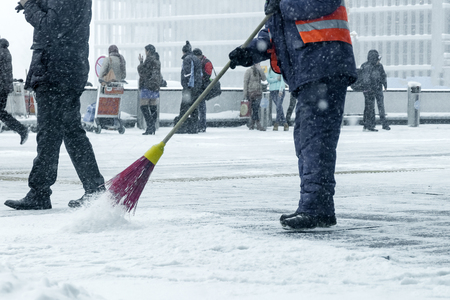 A man cleans the road from the snow.の写真素材