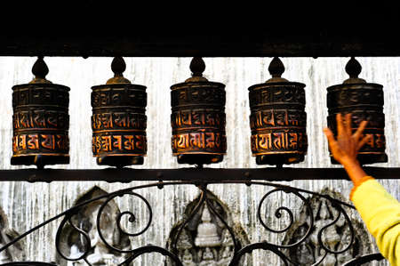 Arm spinning Buddhist prayer wheelsの写真素材