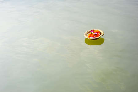 An offering on the Ganges riverの写真素材