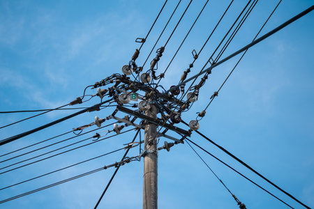 electricity post with blue sky background, power pole with blue skyの写真素材