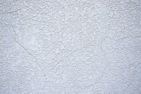 Texture of old rustic wall covered with gray stucco. Abstract background for design.の写真素材