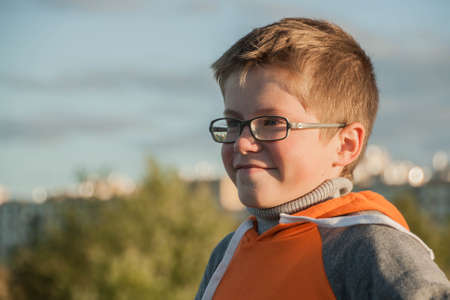 Portrait of a smiling boy with the blue seaの写真素材