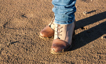 autumn shoes. Conceptual image of legs in boots on the autumn. nature walksの写真素材