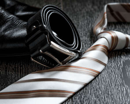 black leather boot strap and tie on a natural backgroundの写真素材