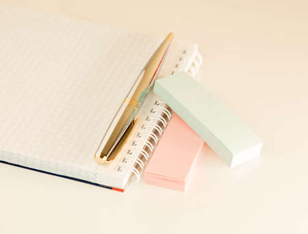 Silver handle with gold inserts papers for writing on a white background. stationery set on a light backgroundの写真素材