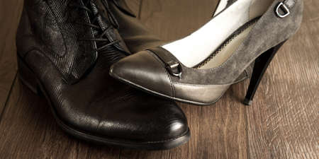 fashionable male and female shoes on a natural backgroundの写真素材