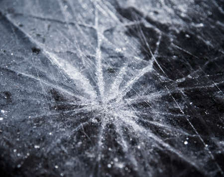 uniform crack in the ice in different directionsの写真素材