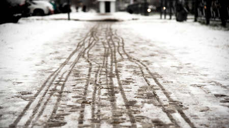 footprints on the snowy sidewalk, the first snow of the year