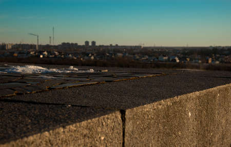 granite tiles and type of winter city of Pskov against the blue sky