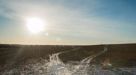 frosty winter day in the village on a background of blue skyの写真素材