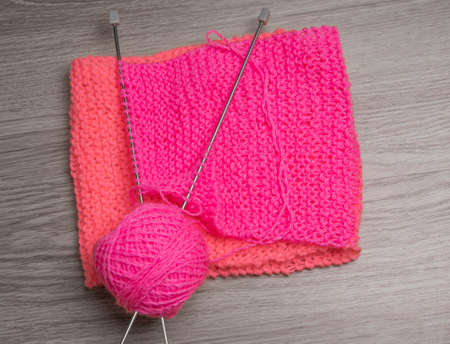 yarns, wool, knitting needles closeup on dark backgroundの写真素材