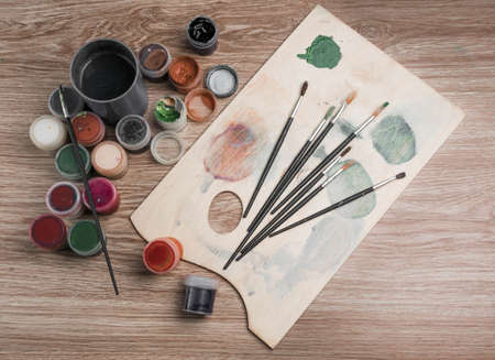 colored pencils paint brush against the dark tableの写真素材