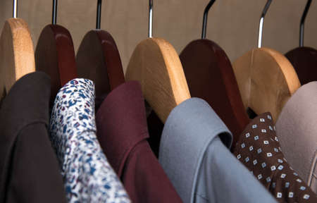 shirts and jackets in the wardrobe isolated closeupの写真素材