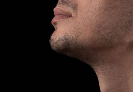 Closeup unshaven chin of a young manの写真素材