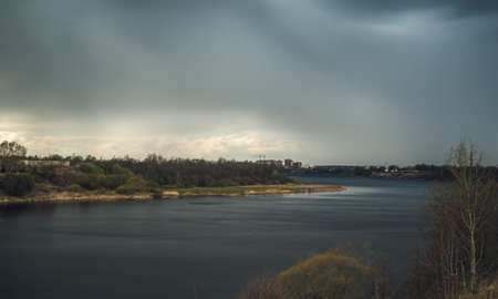 dark clouds before the rain on the river