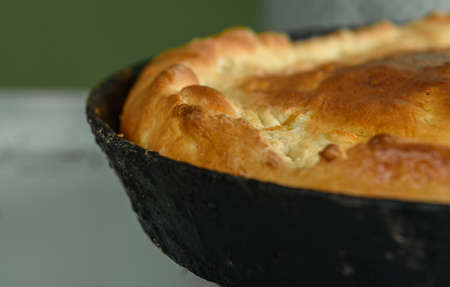 homemade round cake isolated on wooden table backgroundの写真素材