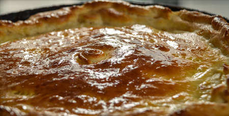 homemade round cake isolated on wooden table backgroundの写真素材