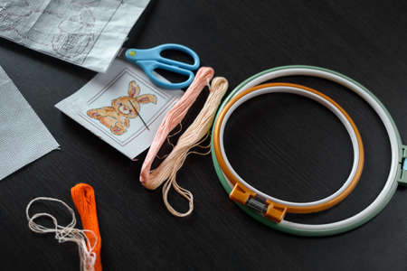 set embroidery floss scissors embroidery thread for embroidering on dark tableの写真素材