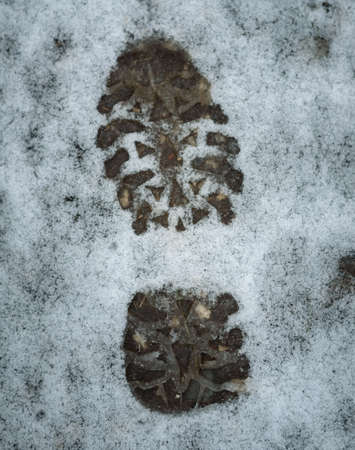 Footprint background after boot on the white snowの写真素材