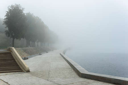 misty morning in Pskov , embankment and the river, foggy morningの写真素材