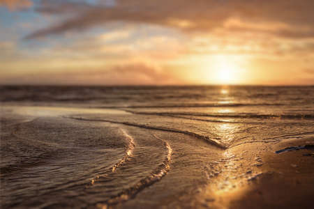 Beautiful Summer Golden sunset on the seaの写真素材